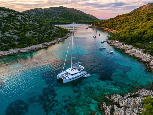 Catamaran anchored in a cove